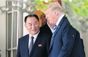  ?? ANDREW HARNIK / THE ASSOCIATED PRESS ?? President Donald Trump talks with Kim Yong Chol, former North Korean military intelligen­ce chief and one of leader Kim Jong Un’s closest aides, as they walk from their meeting in the Oval Office of the White House on Friday.