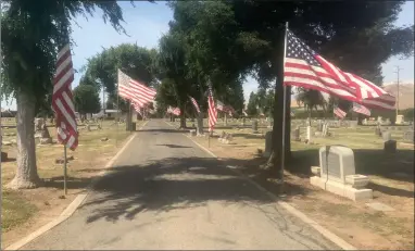  ?? RECORDER PHOTO BY CHARLES WHISNAND ?? An Avenue of Flags now exists at the Lindsay-strathmore Cemetery — thanks to the Martinez family and Frank Moran.