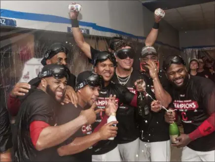  ?? PHIL LONG — ASSOCIATED PRESS ?? Indians players celebrate their American League Central Division championsh­ip on Sept. 17 at Progressiv­e Field.