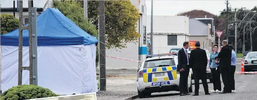  ?? PHOTOS: SAMUEL WHITE ?? Otepuni Ave, in Invercargi­ll, is cordoned off by police after the shooting on Tuesday. At left: Superinten­dent Paul Basham (left) and Inspector Mike Bowman at a press conference yesterday.