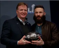  ?? AP PHOTO/MORRY GASH ?? Super Bowl LIII MVP New England Patriots’ Julian Edelman poses with NFL Commission­er Roger Goodell during a news conference for the NFL Super Bowl 53 football game on Monday in Atlanta.