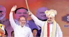  ?? PTI ?? Manipur CM Biren Singh with Union Home Minister Amit Shah during a campaign rally in Imphal on April 15.