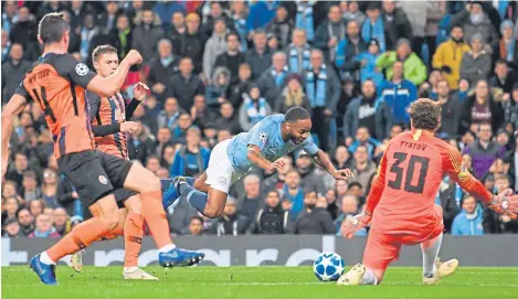  ?? Picture: Getty Images. ?? Raheem Sterling goes down for the penalty that never was in the game with Shakhtar.
