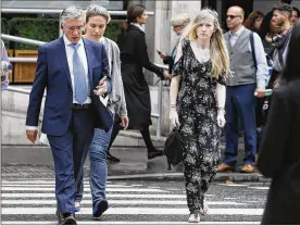  ?? KIRSTY WIGGLESWOR­TH / ASSOCIATED PRESS ?? Connie Yates (right), mother of critically ill baby Charlie Gard, arrives with her legal team at the Royal Courts of Justice in London on Wednesday. A British judge ruled that the baby will be taken to hospice.