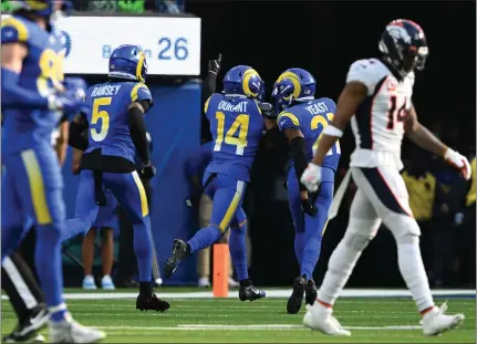  ?? RJ SANGOSTI — THE DENVER POST ?? Rams rookie cornerback Cobie Durant (14) celebrates his 85-yard intercepti­on return for a touchdown during the fourth quarter Sunday.