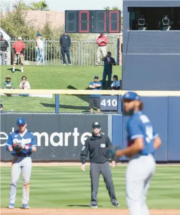  ?? CHRISTIAN PETERSEN/GETTY ?? MLB’s new pitch clock is shaving about 20 minutes off the average length of games this spring.