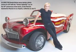  ??  ?? US DIRECTOR Randal Kleiser poses during a photo session for AFP with the “Grease Lightning” car, for the 40th anniversar­y of the movie, at the Petersen Automotive Museum in Los Angeles, California on July 12.