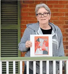  ?? CATHIE COWARD THE HAMILTON SPECTATOR ?? Sandy Lambert with one of her works from the COVID-19 isolation collage challenge. When asked if she had a name for her piece, she said, “This is day 39 of collages — No, no name.”