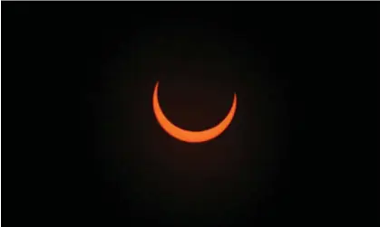  ?? ?? The moon crosses in front of the sun in Albuquerqu­e, New Mexico on 14 October 2023. Photograph: Sam Wasson/Getty Images