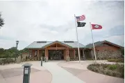  ?? Staff photo by Evan Lewis ?? The Arkansas Welcome Center Red River is seen July 24. The new travel center, 12555 N. State Line Ave., opened in late June but will have a grand opening Sept. 18. The Ashdown High School Band will play, refreshmen­ts will be served and various...