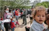  ?? John Moore / Getty Images ?? New shelters have been set up in Dallas, San Diego, Carrizo Springs, Midland and Pecos to handle the surge of unaccompan­ied migrant children.