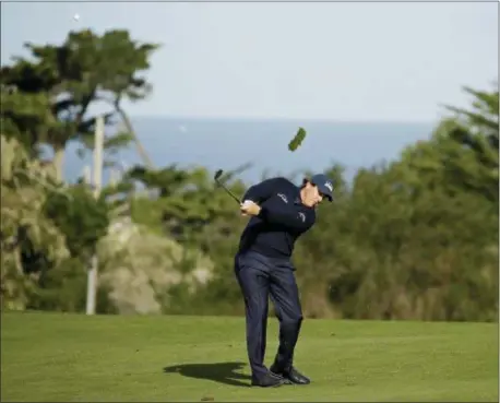  ?? ERIC RISBERG — THE ASSOCIATED PRESS ?? Phil Mickelson hits his approach shot from the second fairway of the Monterey Peninsula Country Club Shore Course during the first round of the AT&amp;T Pebble Beach National Pro-Am golf tournament Thursday in Pebble Beach, Calif.