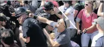  ?? Picture: AP ?? BRAWL: White nationalis­t demonstrat­ors clash with counterdem­onstrators at Lee Park in Charlottes­ville, Virginia, on Saturday.