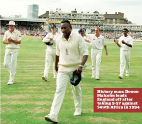  ??  ?? History man: Devon Malcolm leads England off after taking 9-57 against South Africa in 1994