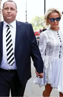  ??  ?? Victory: Mike Ashley, 52, with his wife, Linda