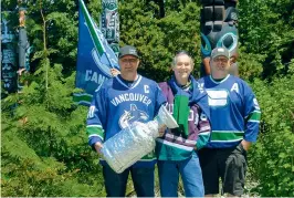  ??  ?? Top: “Vinnie the Viper” has served as the team’s logo from the get-go. Above, from left: “Diesel,” “Coach” a.k.a. Gord, and “Hoss” at the Stanley Park totems in Vancouver prior to Game Seven of the Stanley Cup finals in 2011.