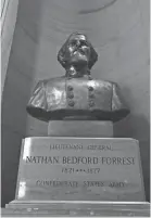  ?? GEORGE WALKER IV/THE TENNESSEAN ?? A bust of Nathan Bedford Forrest, a Confederat­e general and early KKK member, sits in the Tennessee State Capitol.