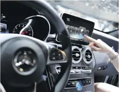  ?? HAROLD CUNNINGHAM / GETTY IMAGES ?? An Apple CarPlay screen is seen in a Mercedes-Benz. Software updates can be critical to a vehicle’s safety.