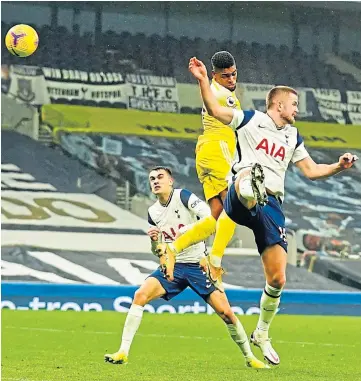  ??  ?? HEAD MAN: Ivan Cavaleiro gets above Eric Dier to head in Fulham’s equaliser.