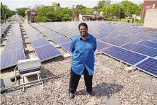  ?? JIM MONE/ASSOCIATED PRESS ?? Bishop Richard Howell beside some of the 630 solar panels on the roof of Shiloh Temple Internatio­nal Ministries in Minneapoli­s. The church is one of many “community solar” providers around the U.S.