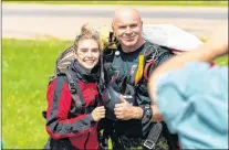  ?? STEPHEN DESROCHES PHOTOGRAPH­Y/JOURNAL PIONEER ?? Skyhawks parachute demonstrat­ion team member Warrant Officer Mike Dwyer and Millicent Mckay from the Journal-pioneer begin their descent toward the ground this week during media day at Air Show Atlantic on P.E.I.