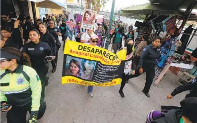  ?? EDUARDO CONTRERAS U-T PHOTOS ?? Women protesting murder and violence against women in Mexico marched for four hours from Tijuana to the San Ysidro Port of Entry on Friday.