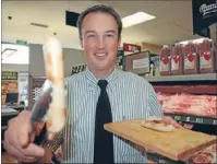  ??  ?? Brilliant banger: An Elsdonmade pork sausage has won gold in a national competitio­n, to the delight of general manager Andrew Preston.