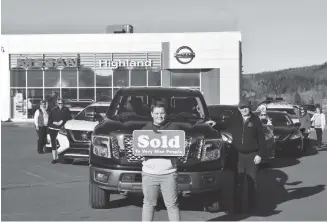  ?? BRENDAN AHERN/THE NEWS ?? Standing in front of a fleet that he helped sell is young Cole Ross, 13, a student at East Pictou Middle School. Over the years Highland Nissan staff added up the revenue that Ross has helped bring in to roughly $300,000.