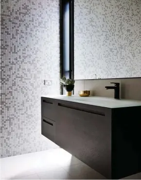  ??  ?? For Where to Buy, see page 187. #
BATHROOM The dark-toned vanity seems to be suspended in midair, while the pixellated patterning of glass mosaic wall tiles suggests movement. Tiles, The City Tiler. Nobili New Road mixer, Reece.
Smart buy: O vessel...