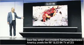  ??  ?? Dave Das, senior vice president, Samsung Electronic­s America, unveils the 98” QLED 8K TV at CES