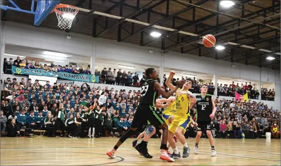  ?? Photo by Domnick Walsh ?? Garry Clifford Tralee CBS (yellow ) and Leroy Odialm, Mercy Mounthawk, in action during their All-Ireland U-19 ‘A’ Schools Basketball Cup semi-final in front of a packed house at the Tralee Sports Complex last Thursday. Mounthawk won and will contest the All-Ireland final in the National Basketball Arena next Tuesday.