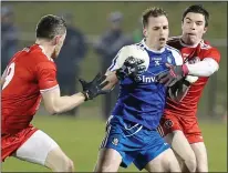  ??  ?? SCRAPPY: Monaghan’s Conor Boyle tries to break free from some dogged Tyrone defending