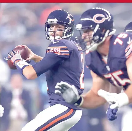  ?? | TOM PENNINGTON/ GETTY IMAGES ?? Backup quarterbac­k Brian Hoyer had a decent night by the numbers Sunday, even as the Bears fell to 0- 3.