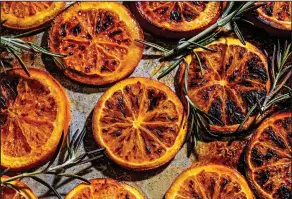  ?? (For The Washington Post/Scott Suchman) ?? Broiled orange slices and rosemary sprigs blend to make Burnt Orange Tonic with Rosemary.