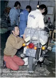  ??  ?? Yamaha factory personnel equip one of the TX500 test bikes.