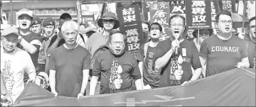  ??  ?? Protesters hold a banner which reads ‘March For Democracy in China’ as they take part in a march in Hong Kong to commemorat­e the June 4, 1989 Tiananmen Square crackdown in Beijing in this file photo. — AFP photo