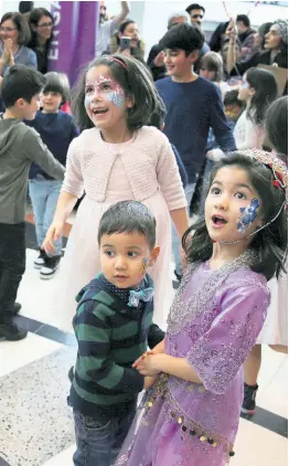  ?? AP ?? Iranian-Canadian children dance with the traditiona­l sound of Saz o Dohol, during the Tirgan Nowruz Festival in Toronto, Canada.