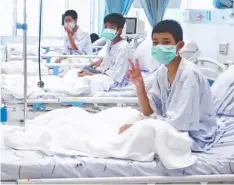  ??  ?? Footage released of members of the Wild Boars football team being treated at a hospital in Chiang Rai.