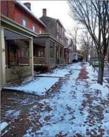  ?? SUBMITTED PHOTO ?? Ed Lotkowski, who lives on the 200 block of West Bernard Street in West Chester, didn’t shovel his sidewalk pictured here and was forced to pay a $125 fine. He’s been working with the borough to give homeowners a break from the stringent shoveling law.