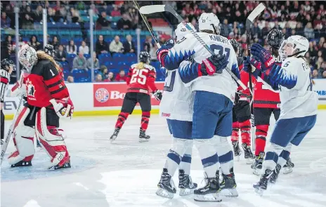  ?? LIAM RICHARDS/THE CANADIAN PRESS ?? Team USA players celebrate after scoring on Canada during first period action at the 2018 Four Nations Cup gold-medal game on Saturday. It was the fourth straight victory for the USA, which has beaten Canada in the finals of eight consecutiv­e tournament­s.