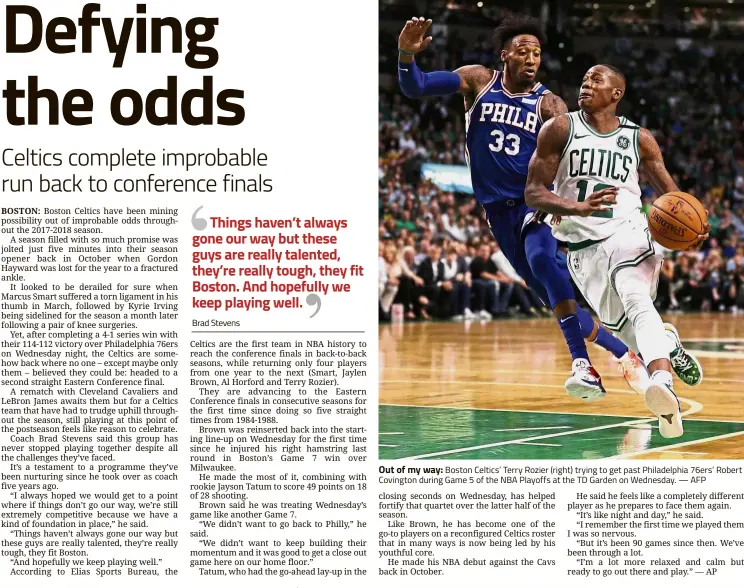  ?? — AFP ?? Out of my way: Boston Celtics’ Terry Rozier (right) trying to get past Philadelph­ia 76ers’ Robert Covington during Game 5 of the NBA Playoffs at the TD Garden on Wednesday.