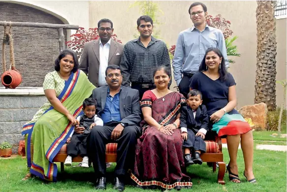  ??  ?? ONE FOR ALL, ALL FOR ONE: N. Emanuel and wife Hyacinth Emanuel (centre) with eldest daughter Anisha Lloyd (left) her husband Lloyd Raphael (in brown suit), younger daughter Niharika Lawrence (right), her husband Krispian Lawrence (in the grey shirt)...