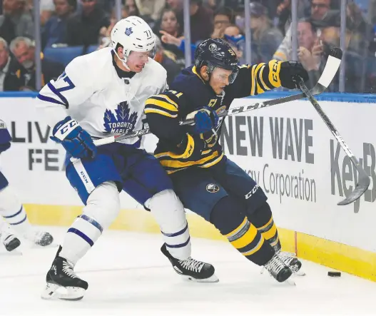  ?? ADRIAN KRAUS/THE ASSOCIATED PRESS ?? Toronto Maple Leafs centre Adam Brooks, left, credited the John Paddock regime in Regina for helping him prepare to be a profession­al hockey player.