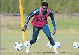  ?? DARRYL DYCK THE CANADIAN PRESS ?? Alphonso Davies played a full year of profession­al soccer this season with Vancouver. Born in a refugee camp in Ghana, Canada took his family in. They live in Edmonton.