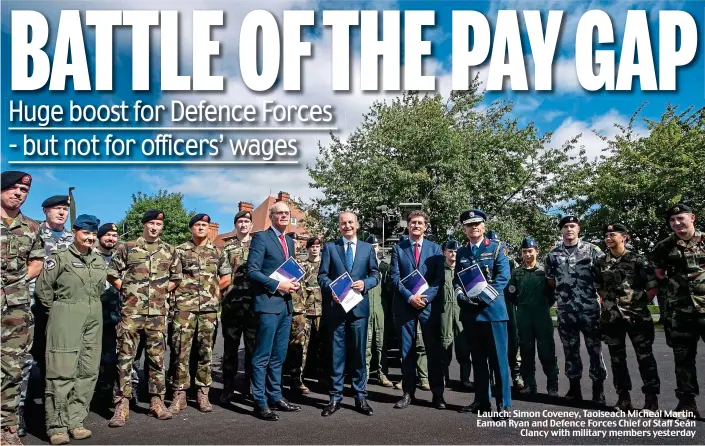  ?? ?? Launch: Simon Coveney, Taoiseach Micheál Martin, Eamon Ryan and Defence Forces Chief of Staff Seán Clancy with military members yesterday