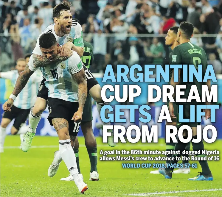  ?? — GETTY IMAGES ?? Lionel Messi jumps on Marcos Rojo’s back after Rojo scored Argentina’s game-winning goal on Tuesday during a Group D match against Nigeria at Saint Petersburg Stadium in Russia.