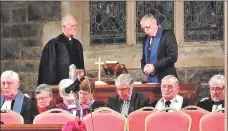  ??  ?? Willem Jacobus Bezuidenho­ut, left, is inducted into his new ministry.