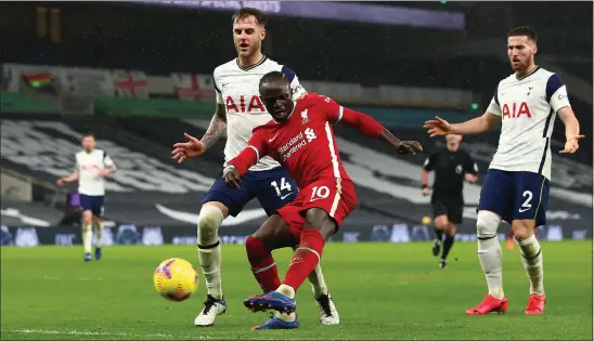  ??  ?? Sadio Mane scores the opener for Liverpool at Anfield last night after more than eight hours since their last goal