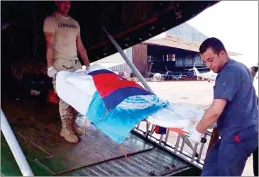  ?? SUPPLIED ?? The body of Cambodian UN peacekeepe­r Im Sam, who was killed in a guerrilla attack on Monday night, is taken off of a plane in Bria, in Central African Republic.