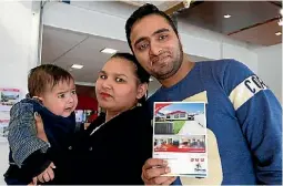  ?? ROSS GIBLIN/FAIRFAX NZ ?? New owners of a Pringle St home in Taita are Neeraj Narwal and his wife Bharti Sirohi, who is holding their son Vivaan.